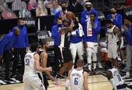 The LA Clippers' Marcus Morris scores a three-point basket